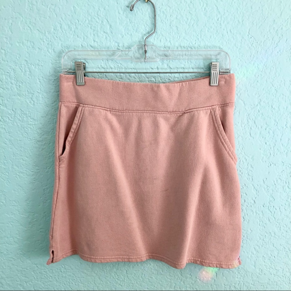 Pact organic cotton stretchy pink mini skirt with pockets.